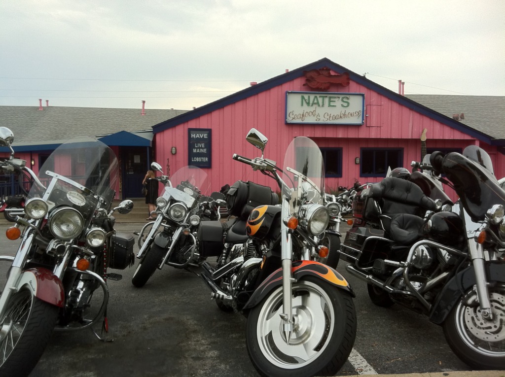 Motorcycles parked outside Nate's pink restaurant